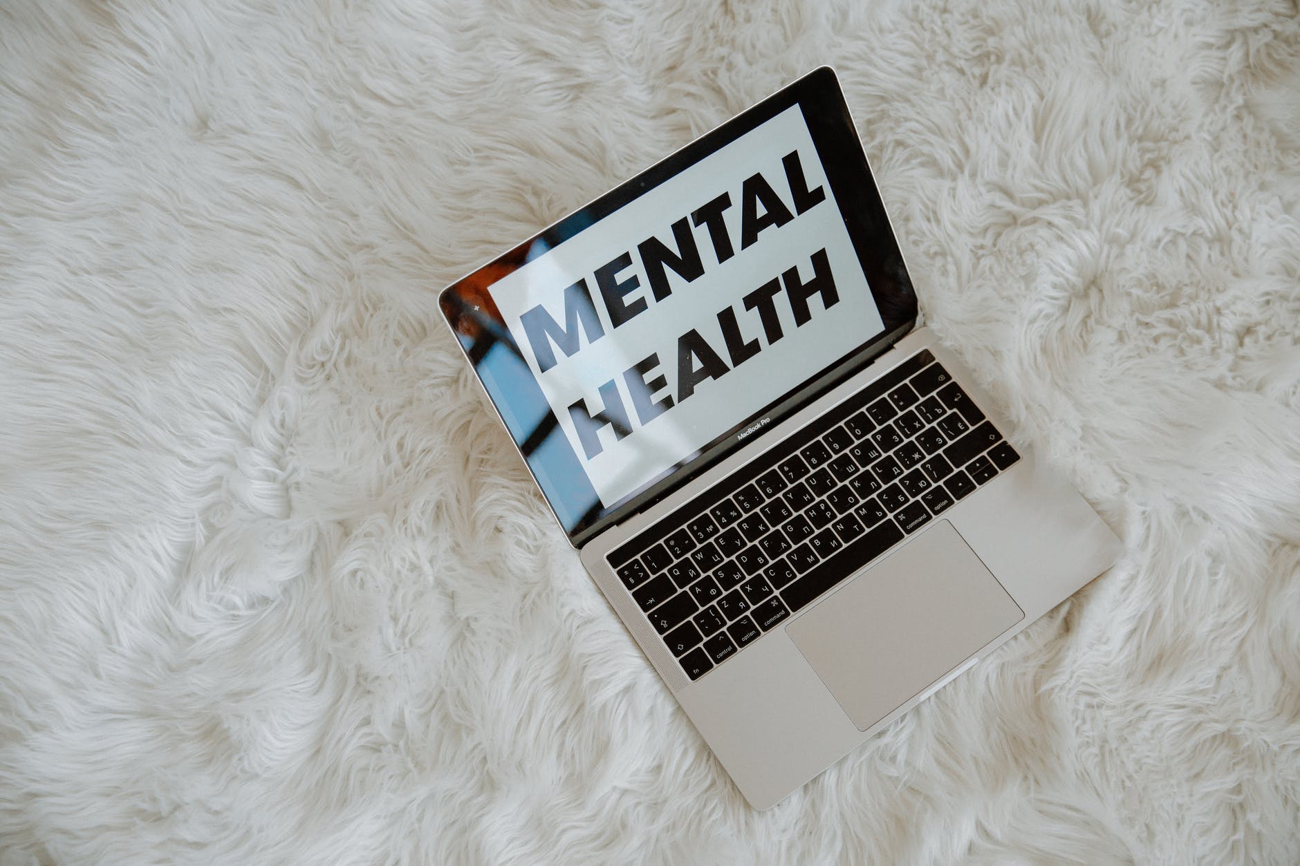 the words mental health on laptop screen